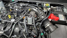 Load image into Gallery viewer, J&amp;L 19-23 Ford/Lincoln SUVs &amp; Trucks w 2.0 EcoBoost Driver Side Oil Separator 3.0 - Clear An