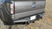 Load image into Gallery viewer, Addictive Desert Designs 10-14 Ford F-150 Raptor HoneyBadger Rear Bumper w/ Tow Hooks