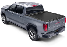 Load image into Gallery viewer, Roll-N-Lock 09-18 RAM 1500 / 10-22 RAM 2500-3500 (76.3in. Bed Length) A-Series XT Retractable Cover
